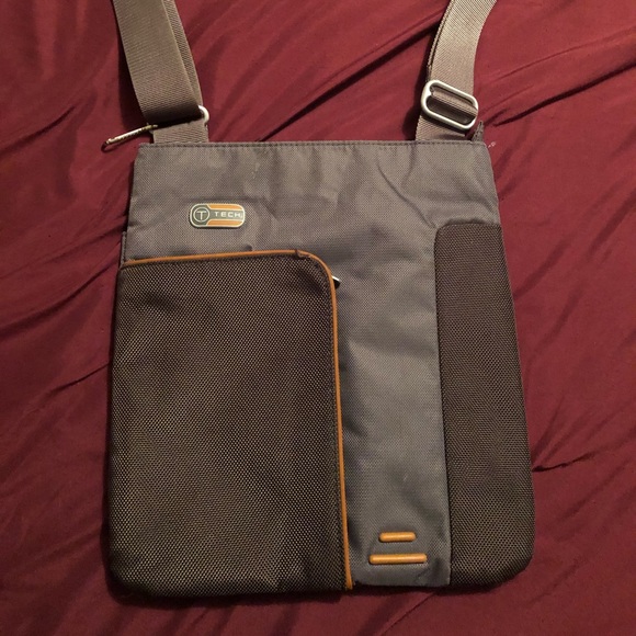 tumi tech crossbody bag